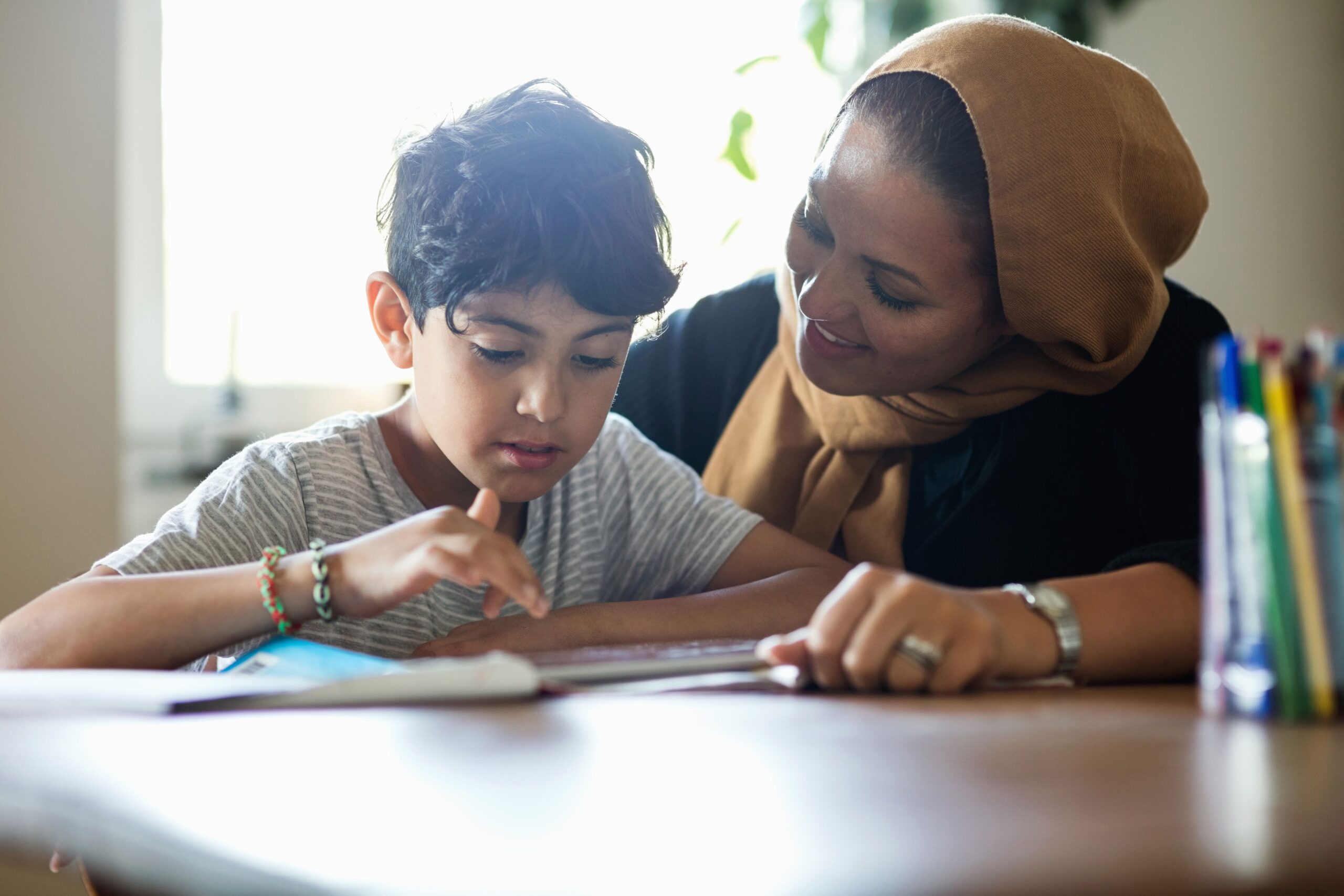 Mother doing homework with child